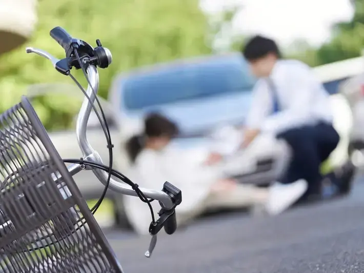 Attorney reviewing hit and run pedestrian death claim evidence connected to Avondale retail corridor surveillance footage